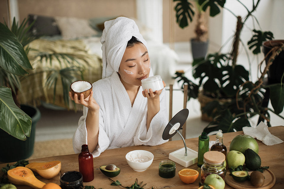 Young,Asian,Woman,In,White,Bathrobe,And,Towel,Holding,Half